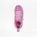 A single children's high-top sneaker shown from a top-down view on a clean white background. The shoe features a vibrant pink base with a multicolor abstract pattern in blue, purple, and red across the upper, pink laces, and a pink pull tab.